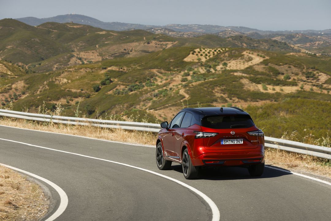 3. New refreshed Qashqai 2024 in fuji sunset color driving on the road in Faro, Portugal